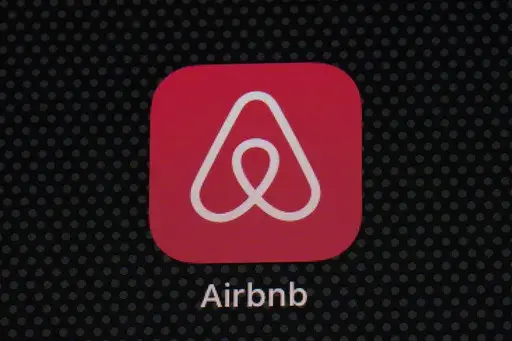 The Airbnb app icon is displayed on an iPad screen in Washington, D.C., on May 8, 2021. Airbnb says it's cracking down on fake listings, which are emerging as a major problem for customers of the short-term rental site. Airbnb said Wednesday Sept. 20 2023 it has removed 59,000 fake listings and blocked another 157,000 from joining the site this year. Fake listings and high cleaning fees are among several issues that customers are raising with Airbnb. (AP Photo/Patrick Semansky, File)