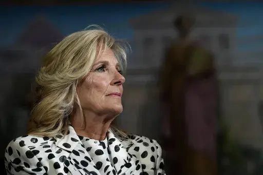 First lady Jill Biden waits to speak at the Library of Congress in Washington, Wednesday, April 19, 2023, during a reception with congressional members and spouses showcasing bipartisan support for cancer prevention and early detection. (AP Photo/Susan Walsh, File)
