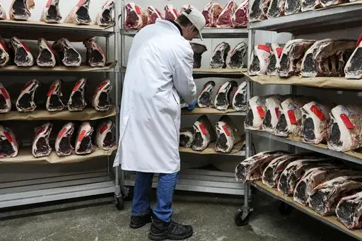John Jobbagy shows dry aged beef during an interview at J.T. Jobbagy Inc. in the Meatpacking District of Manhattan, Tuesday, Nov. 19, 2024, in New York. (AP Photo/Julia Demaree Nikhinson)