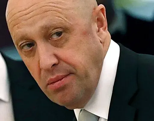 Russian businessman Yevgeny Prigozhin is shown prior to a meeting of Russian President Vladimir Putin and Chinese President Xi Jinping in the Kremlin in Moscow, Russia, on Tuesday, July 4, 2017. Prigozhin, an entrepreneur known as "Putin's chef" because of his catering contracts with the Kremlin, has admitted he interfered in U.S. elections and says he will continue to do so — for the first time confirming the accusations he has been rejecting for years. "We have interfered, are interfering an