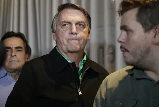 Brazil's former President Jair Bolsonaro prepares to speak to the press in Belo Horizonte, Brazil, June 30, 2023, the day that judges ruled him ineligible to run for political office until 2030 after concluding that he abused his power and cast unfounded doubts on the country's electronic voting system. (AP Photo/Thomas Santos, File)