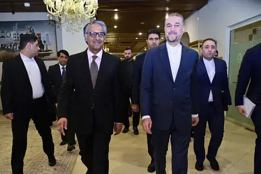 In this photo released by Pakistan's Ministry of Foreign Affairs, visiting Iran's Foreign Minister Hossein Amirabdollahian, front right, walks with his Pakistani counterpart Jalil Abbas Jilani, front left, upon his arrival for a meeting at the Ministry of Foreign Affairs in Islamabad, Pakistan, Monday, Jan. 29, 2024. Iran's foreign minister was in Pakistan for talks on deescalating tensions after deadly airstrikes by Tehran and Islamabad earlier this month killed at least 11 people, marking a si