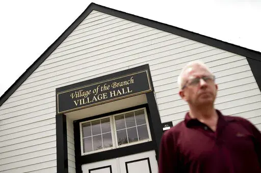 Mark Delaney, Mayor of Village of the Branch, a village in the Town of Smithtown in Suffolk County, stands outside Village Hall, Thursday, June 2, 2022, in Smithtown, N.Y. From small towns to big cities, every government across the U.S. was offered a slice of $350 billion of federal coronavirus relief funds intended to help shore up their finances, fight the virus and invest in community projects. Nearly 1,500 local government said "no," turning down a total of about $60 million of aid, accordin