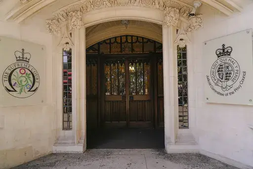 The Supreme Court entrance is photographed in London, Tuesday, Oct. 11, 2022. The British government's contentious policy to stem the flow of migrants faces one of its toughest challenges this week as the U.K. Supreme Court weighs whether it’s lawful to send asylum-seekers to Rwanda starting on Monday, Oct. 9, 2023. (AP Photo/Alberto Pezzali, File)