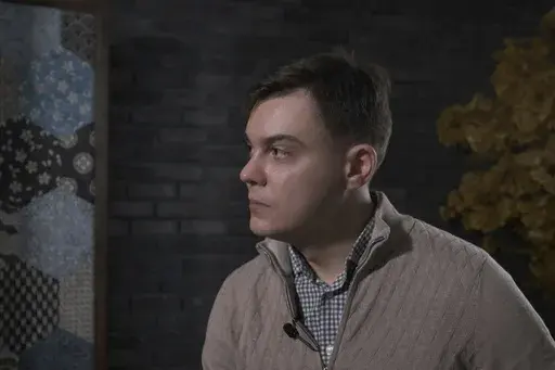 In this image from video provided by the Dossier Center, a London-based investigative group funded by Russian opposition figure Mikhail Khodorkovsky, Gleb Karakulov speaks during an interview in Turkey in December 2022. Karakulov, who was responsible for setting up secure communications for Russian President Vladimir Putin, said moral opposition to Russia’s invasion of Ukraine and his fear of dying there drove him to speak out, despite the risks to himself and his family. He said he hoped to i