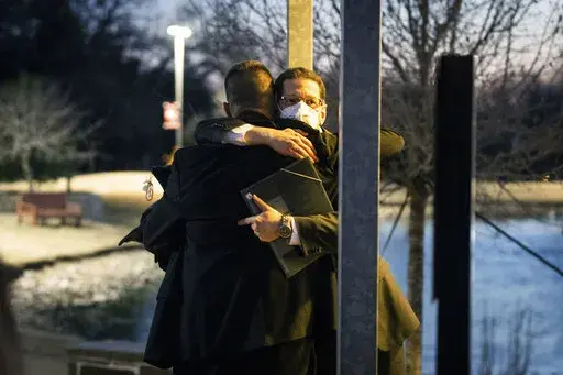 Congregation Beth Israel Rabbi Charlie Cytron-Walker, facing camera, hugs a man after a healing service Monday night, Jan. 17, 2022, at White's Chapel United Methodist Church in Southlake, Texas. Cytron-Walker was one of four people held hostage by a gunman at his Colleyville, Texas, synagogue on Saturday. (Yffy Yossifor/Star-Telegram via AP, File)