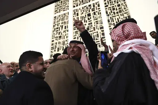 Members of the Saudi Arabia delegation react as the Bureau International des Expositions, or BIE, announces the vote Tuesday, Nov. 28, 2023 in Issy-les-Moulineaux, outside Paris. Saudi Arabia's capital Riyadh was chosen to host the 2030 World Expo, beating out South Korean port city Busan and Rome for an event expected to draw millions of visitors. Saudi Arabia's capital Riyadh was chosen on Tuesday to host the 2030 World Expo, beating out South Korean port city Busan and Rome for an event expec