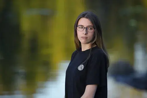 Alyssa Burns, 24, is photographed at a park on Friday, Oct. 7, 2022, in Orlando, Fla.  It has always been difficult to be pregnant on the job and to raise a child, but especially so for low-wage workers. They are more likely to work in physically demanding roles with fewer labor protections and less flexibility than higher-wage jobs. When Burns, a warehouse worker earning $16 an hour, learned she was pregnant she came to the agonizing conclusion she couldn't go through with it.  (AP Photo/Phelan