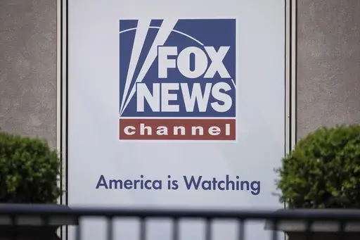 The Fox News logo is displayed outside Fox News Headquarters in New York, April 12, 2023. Former President Donald Trump's decision to back out of Fox News' first GOP primary debate this week likely costs the network a chance at a very large audience for the end of summer. It also tests the network's ability to pivot yet again after what has been a tough year, paying $787 million to settle a defamation lawsuit just as a trial was to begin, and firing popular personality Tucker Carlson shortly aft