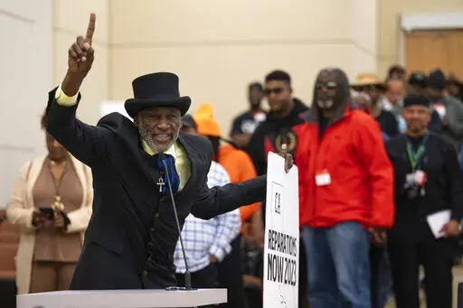 Morris Griffin, of Los Angeles, speaks during the public comment portion of the Reparations Task Force meeting in Sacramento, Calif., on Friday, March 3, 2023. California’s statewide task force on Black American reparations continues to delve into key questions on eligibility and what form reparations may take.(Paul Kitagaki Jr./The Sacramento Bee via AP)