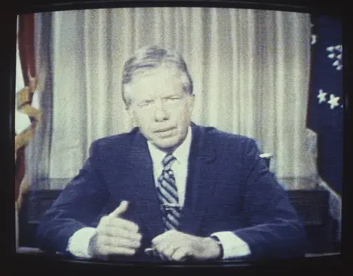 In an image from a television screen, President Jimmy Carter delivers his energy speech in which he spoke of a "crisis of confidence," July 15, 1979, from the Oval Office at the White House in Washington. Some referred to the speech as his "malaise speech," although he never used that word during it. (AP Photo/Dale G. Young, File)