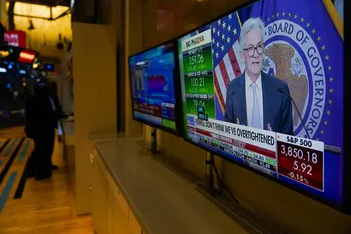 Traders work on the floor at the New York Stock Exchange as the Federal Reserve chairman Jerome Powell speaks after announcing a rate increase in New York, Wednesday, Nov. 2, 2022. (AP Photo/Seth Wenig)