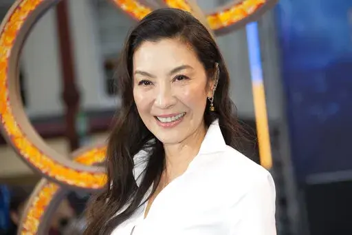Michelle Yeoh appears at the premiere of "Shang-Chi and the Legend of the Ten Rings," in West London on Aug 26, 2021. Yeoh stars in the genre-twisting “Everything Everywhere All At Once" playing an Asian immigrant wife and mother trying to be everything for everyone. (Photo by Joel C Ryan/Invision/AP, File)