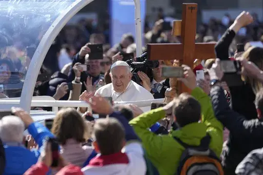 Pope Francis arrives for a mass in Kossuth Lajos' Square in Budapest, Hungary, Sunday, April 30, 2023. (AP Photo/Darko Vojinovic)