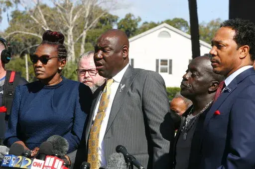 Attorney Benjamin Crump speaks to the media Tuesday, Feb. 22, 2022 outside the federal courthouse in Brunswick, Ga. The three men convicted of murder in Ahmaud Arbery’s fatal shooting have been found guilty of federal hate crimes. A jury delivered its verdict Tuesday after several hours of deliberations. (AP Photo/Lewis Levine)