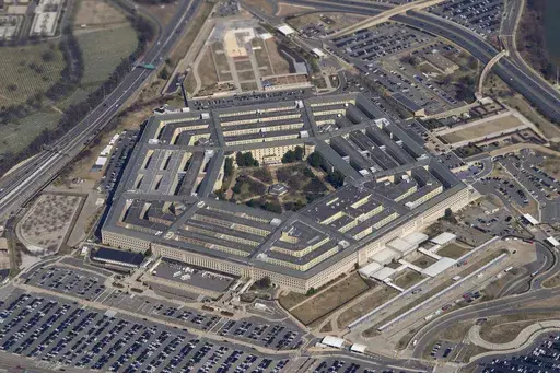 The Pentagon is seen from Air Force One as it flies over Washington, March 2, 2022. A fake image purportedly showing an explosion near the Pentagon has been widely shared on social media, sending a brief shiver through the stock market. But police and fire officials in Arlington, Va., said Monday, May 22, 2023, that the image isn't real and there was no incident at the U.S. Department of Defense headquarters. (AP Photo/Patrick Semansky, File)