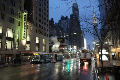 The New Yorker Hotel sign glows at dusk, Wednesday, April 17, 2013 in New York. (AP Photo/Mark Lennihan, File)