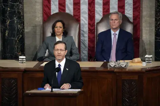 Israeli President Isaac Herzog speaks to a joint session of Congress, Wednesday, July 19, 2023, at the Capitol in Washington, as Vice President Kamala Harris and House Speaker Kevin McCarthy of Calif., look on. (AP Photo/Jacquelyn Martin)