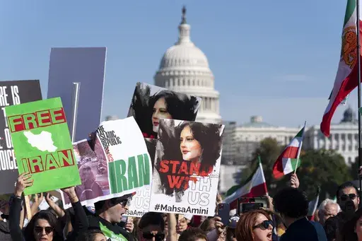 Demonstrators rally at the National Mall in Washington to protest against the Iranian regime, Oct. 22, 2022, following the death of Mahsa Amini in the custody of the Islamic republic's notorious "morality police." The United Nations announced Tuesday, May 2, 2023, that its premiere prize for press freedom has been awarded to three imprisoned Iranian women journalists. (AP Photo/Jose Luis Magana, File)