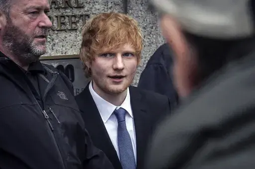Ed Sheeran leaves federal court, Thursday, April 27, 2023, in New York. In a packed New York courtroom, a cheerful Ed Sheeran picked up his guitar Thursday and launched into a few bars of a tune that has him locked in a copyright dispute over Marvin Gaye's soul classic “Let's Get it On" . (AP Photo/Bebeto Matthews)