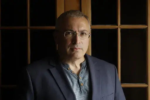 Russian opposition figure Mikhail Khodorkovsky, the former owner of the Yukos Oil Co., poses for a photo after being interviewed by The Associated Press in London, Tuesday, July 24, 2018. After President Vladimir Putin came to power in 2000, he was reported to have told about two dozen of the men regarded as Russia's top oligarchs that if they stayed out of politics, their wealth wouldn't be touched. Khodorkovsky, regarded as Russia's richest man at the time, established the Open Society reformi