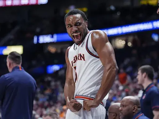 Auburn forward Chris Moore reacts on the bench after a Tiger's basket during the first half of an NCAA college basketball game against South Carolina at the Southeastern Conference tournament Friday, March 15, 2024, in Nashville, Tenn. (AP Photo/John Bazemore)