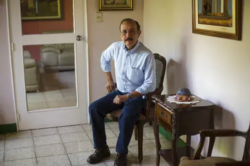Retired Sandinista Gen. Hugo Torres poses for portrait at his home, in Managua, Nicaragua, May 2, 2018. The former Sandinista guerrilla leader and opposition politician died in prison at the age of 73, relatives said Saturday, Feb. 12, 2022. Torres was the first of a large group of opposition leaders rounded up in a 2021 crackdown to die; it was unclear if his death was hastened by conditions in prison. (AP Photo/Moises Castillo, File)