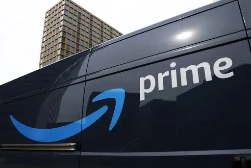 An Amazon Prime delivery vehicle is seen in downtown Pittsburgh on March 18, 2020. The Federal Trade Commission sued Amazon on Wednesday for what it called a years-long effort to enroll consumers without consent into its Prime program and making it difficult for them to cancel their subscriptions. (AP Photo/Gene J. Puskar, File)
