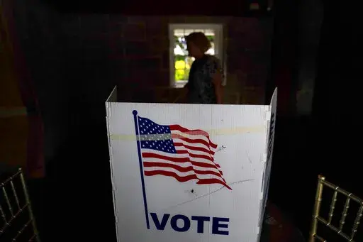 A person waits in line to vote in the Georgia's primary election on May 24, 2022, in Atlanta. A new poll shows 71% of voters think the future of the country is at stake when they vote in November's midterm elections. That's according to a new poll from The Associated Press-NORC Center for Public Affairs Research. (AP Photo/Brynn Anderson, File)