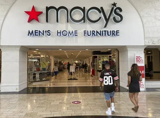 Shoppers walk into a Macy's department store Monday, Feb. 22, 2021, at Miami International Mall in Doral, Fla. Macy's reports earnings on Thursday, Nov. 16, 2023. (AP Photo/Wilfredo Lee, File)
