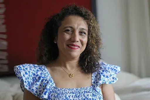 Monica Fulton poses at her home Monday, Nov. 20, 2023, in Houston. Fulton prioritizes giving to organizations that serve the city's residents, like the food bank, a homeless shelter and an arts education organization. The Tuesday after Thanksgiving, GivingTuesday started in 2012 as a hashtag and it has become a central part of nonprofit fundraising. (AP Photo/David J. Phillip)