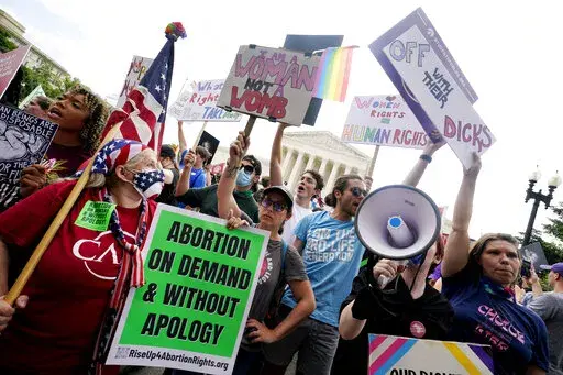 People protest about abortion, Friday, June 24, 2022, outside the Supreme Court in Washington. The Supreme Court has ended constitutional protections for abortion that had been in place nearly 50 years — a decision by its conservative majority to overturn the court's landmark abortion cases. (AP Photo/Steve Helber)