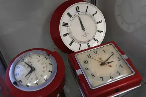 A selection of vintage clocks are displayed at the Electric Time Company, March 9, 2023, in Medfield, Mass. Next week across most of the U.S., the sun will set well before many folks step foot out of the office. Cue running errands or taking evening walks in utter darkness. Come Nov. 5, daylight saving time is out and standard time is in, and will last until March 10. (AP Photo/Charles Krupa, file)