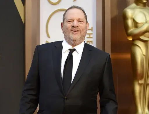 Movie mogul Harvey Weinstein arrives at the Oscars at the Dolby Theatre in Los Angeles, March 2, 2014. Opening statements are set to begin Monday in the disgraced movie mogul Harvey Weinstein's Los Angeles rape and sexual assault trial. Weinstein is already serving a 23-year-old sentence for a conviction in New York. (Photo by Jordan Strauss/Invision/AP, File)