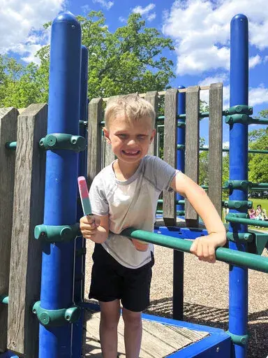 This handout photo provided by The Roberts family shows Cooper Roberts who along with his twin brother and parents attended the July 4 parade in Highland Park, Ill. Cooper was struck in the chest in a hail of gunfire that left dozens of others wounded and seven dead, said Tony Loizzi, a family spokesperson. (The Roberts Family via AP)