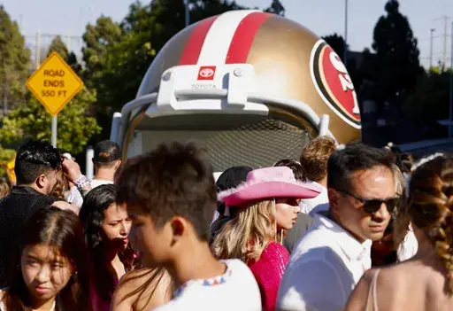 Fans wait to go through security before Taylor Swift performs at Levi's Stadium in Santa Clara, Calif., Friday, July 28, 2023. Fan frustration over getting tickets to Swift's tour prompted Congressional hearings and multiple bills in state legislatures. Consumer advocates in California say they are disappointed legislation in California has been watered down to solely banning hidden fees, a practice most major industry players have already committed to do. (Jessica Christian/San Francisco Chroni