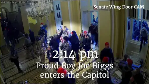 This image from video from a police worn body camera from the Jan. 6 riot at the U.S. Capitol, was played as a committee exhibit as the House select committee investigating the the Jan. 6 attack on the U.S. Capitol, held a hearing Thursday, June 9, 2022, on Capitol Hill in Washington. (House Select Committee via AP)