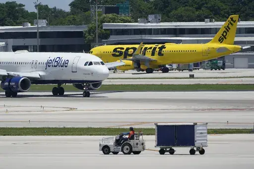 A JetBlue Airways Airbus A320, left, passes a Spirit Airlines Airbus A320 as it taxis on the runway, July 7, 2022, at the Fort Lauderdale-Hollywood International Airport in Fort Lauderdale, Fla. What's next for Spirit Airlines, now that it won't be merging with JetBlue? Some Wall Street analysts are starting to raise the possibility of bankruptcy. Spirit Airlines stock was falling again on Wednesday, Jan 17, 2024, a day after a federal judge blocked JetBlue's proposed $3.8 billion purchase of Sp