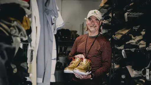 This photo provided by the Portland Rescue Mission shows James Free posing for a photo with a pair of of gold Nike Air Jordan 3 sneakers at the Portland Rescue Mission on Sunday, Oct. 30, 2023, in Portland, Ore. The sneakers, designed in 2019 for filmmaker Spike Lee, that were donated to the homeless shelter, sold for nearly $51,000 at auction on Monday, Dec. 18. (Aaron Ankrom/Portland Rescue Mission via AP)