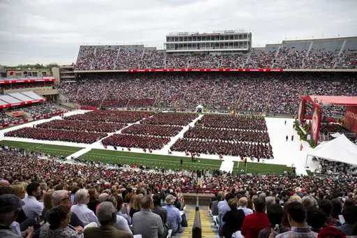 Attendees watch the 170th University of Wisconsin-Madison commencement ceremony at Camp Randall Stadium in Madison, Wis., on May 13, 2023. Republican lawmakers were poised Tuesday, June 13, to cut funding for University of Wisconsin campuses as the GOP-controlled state Legislature and school officials continue to clash over efforts to promote diversity and inclusion. (Samantha Madar/Wisconsin State Journal via AP, File)