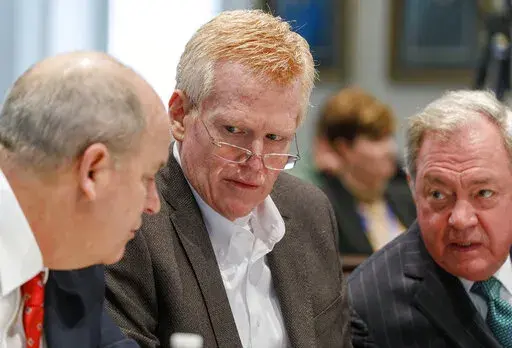 Defendant Alex Murdaugh, seated between his two layers Jim Griffin and Dick Harpootlian, listens during his double murder trial at the Colleton County Courthouse in Walterboro, S.C., Friday, Jan. 27, 2023. (Grace Beahm Alford/The Post And Courier via AP, Pool)