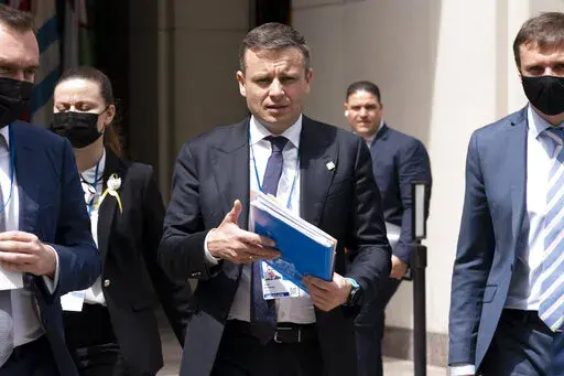 Ukraine Finance Minister Serhiy Marchenko walks outside of the International Monetary Fund (IMF) building during the World Bank/IMF Spring Meetings in Washington, on April 21, 2022. Ukraine's finance minister says crucial Western financial aid is “not charity” but “self-preservation" as donor countries share the price of turning back Russian aggression. Marchenko told The Associated Press in an interview Thursday, Dec. 8 that his country is protecting freedom and democracy far beyond its b