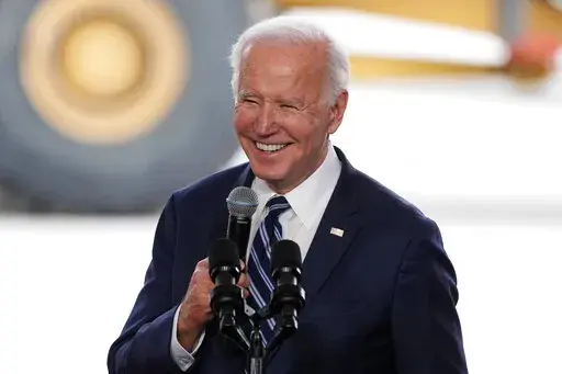 President Joe Biden smiles as he speaks after touring the Taiwan Semiconductor Manufacturing Company facility under construction in Phoenix, on Dec. 6, 2022. Biden is facing consistent but critical assessments of his leadership and the national economy as his second year in the White House comes to a close. A new poll from The Associated Press-NORC Center for Public Affairs Research finds 43% of U.S. adults say they approve of the way Biden is handling his job as president, while 55% disapprove.