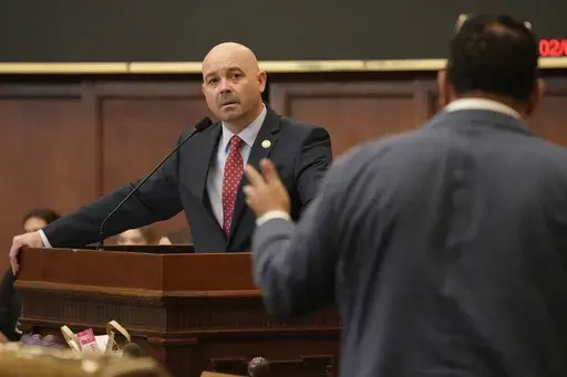 Mississippi Rep. Cedric Burnett, D-Tunica, right, asks a question of Mississippi House Gaming Committee Chairman Casey Eure, R-Saucier, regarding the Mississippi Mobile Sports Wagering Act, Feb. 1, 2024, during floor debate in the House of Representatives at the state Capitol in Jackson, Miss. Mobile sports betting will remain illegal in Mississippi after legislative negotiators failed to advance a final proposal Monday, April 29. (AP Photo/Rogelio V. Solis, File)