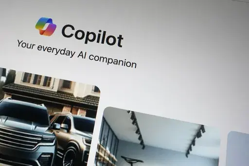 A Copilot page showing the incorporation of AI technology is shown in London, Tuesday, Feb. 13, 2024. A Microsoft engineer is sounding an alarm Wednesday, March 6, 2024, about offensive and harmful imagery he says is too easily made by the company’s artificial intelligence image-generator tool. (AP Photo/Alastair Grant, File)