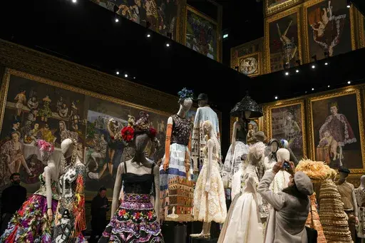 Creations are displayed during the exhibition "From the Heart to the Hands: Dolce&Gabbana" at the Grand Palais, in Paris, Thursday, Jan. 9, 2025. (AP Photo/Thibault Camus)