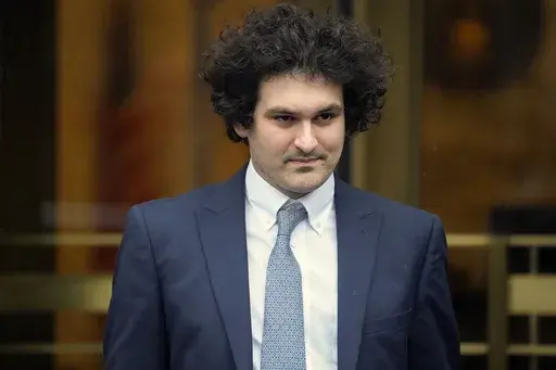 FILE — FTX founder Sam Bankman-Fried leaves Manhattan federal court in New York, Feb. 16, 2023. Prosecutors said Monday, Aug. 14, they'll use testimony from Bankman-Fried's “trusted inner circle” of former executives at his collapsed cryptocurrency empire against him at an October trial. (AP Photo/John Minchillo, File)