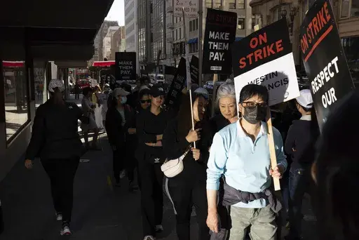 Hotel workers picket outside the Westin St. Francis Monday, Sept. 2, 2024, in San Francisco. (AP Photo/Benjamin Fanjoy)