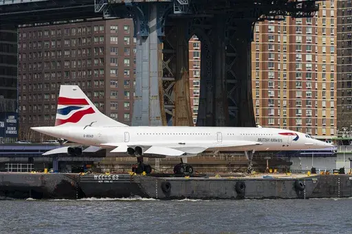 A retired British Airways Concorde supersonic aircraft is transported by barge on the East River, Wednesday, March 13, 2024, in New York. (AP Photo/Peter K. Afriyie)