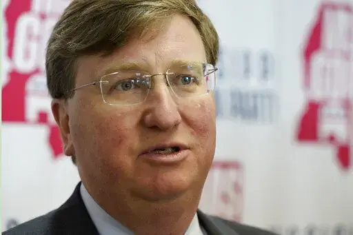 Mississippi Gov. Tate Reeves lists the accomplishments of his administration as he speaks with reporters at the party headquarters after filing his qualifying papers to run for reelection, Tuesday, Jan. 3, 2023, in Jackson, Miss. (AP Photo/Rogelio V. Solis)